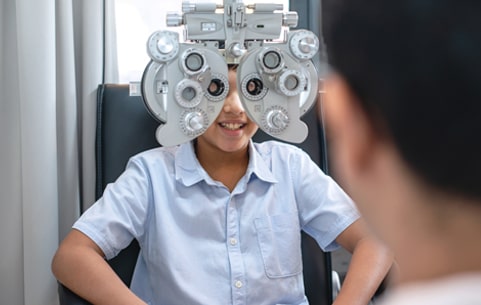 Young boy getting a pediatric eye exam at Somerset Eye Care in NJ