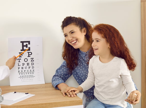 Mother and young girl getting a pediatric eye exam at Somerset in NJ