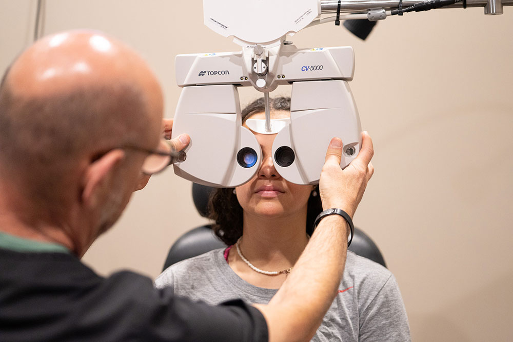 Dr. Jonathan Fishbein examining a patient's eyes at Somerset in North Brunswick