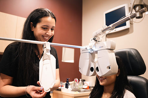 Optometrist and smiling patient during exam at Somerset in New Jersey