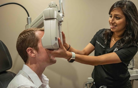 Man getting an eye exam from an optometrist
