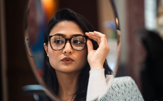 Woman trying on glasses