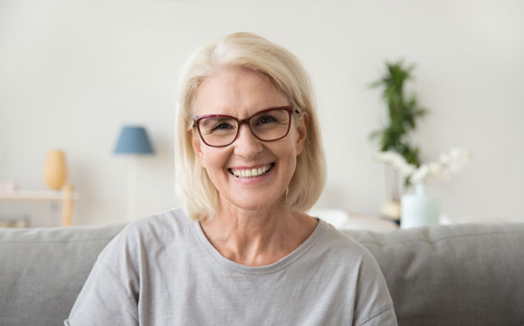 Woman smiling wearing glasses