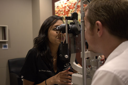 Woman getting a diagnosis for glaucoma treatment with state of the art technology at Somerset Eye Care in North Brunswick Township